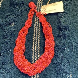 Beaded twist necklace in coral, ball clasp, approximately 18”